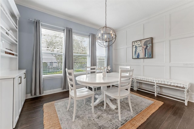 dining area with a decorative wall, a chandelier, baseboards, ornamental molding, and dark wood-style flooring