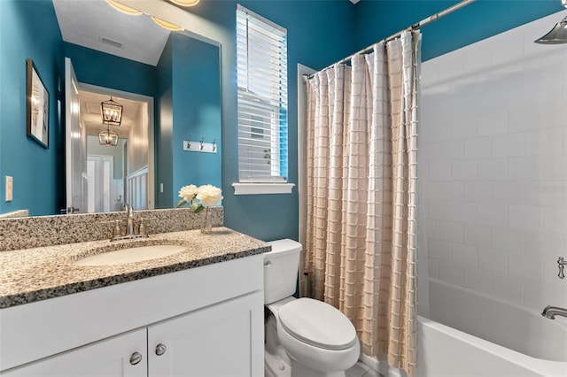 full bath featuring toilet, shower / bath combination with curtain, and vanity