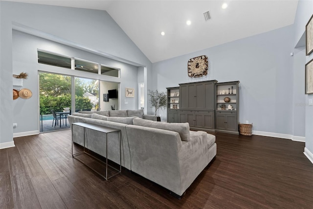 living area with high vaulted ceiling, dark wood-style flooring, baseboards, and recessed lighting