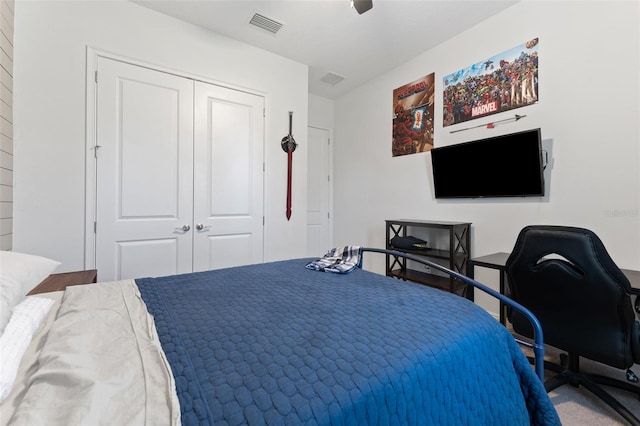 bedroom featuring a closet, carpet floors, ceiling fan, and an office area