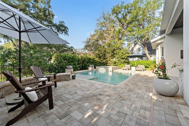 swimming pool featuring a patio area