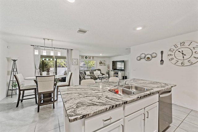 10463 Baylor Dr, Spring Hill, FL 34608 - kitchen with white cabinets, dishwasher, visible vents, a sink, and open floor plan