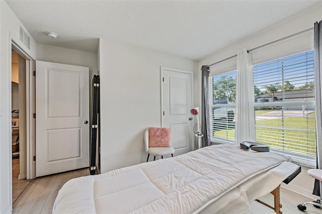 10463 Baylor Dr, Spring Hill, FL 34608 - bedroom featuring visible vents and light wood finished floors
