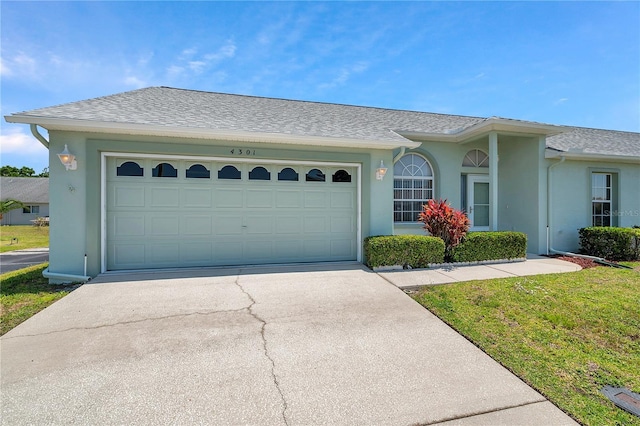 ranch-style house featuring an attached garage, a shingled roof, stucco siding, and concrete driveway
