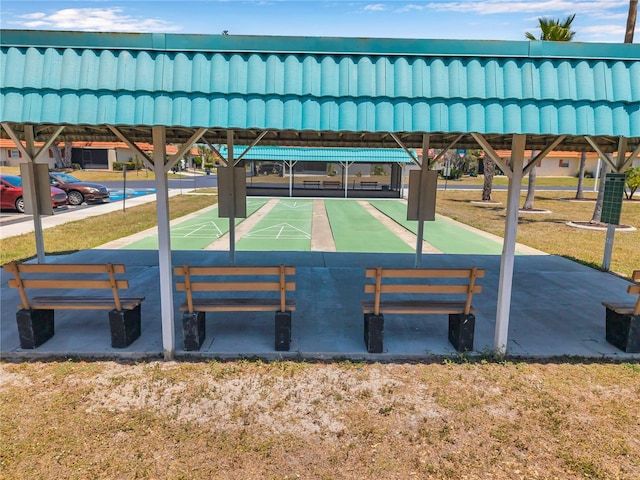 view of property's community featuring shuffleboard
