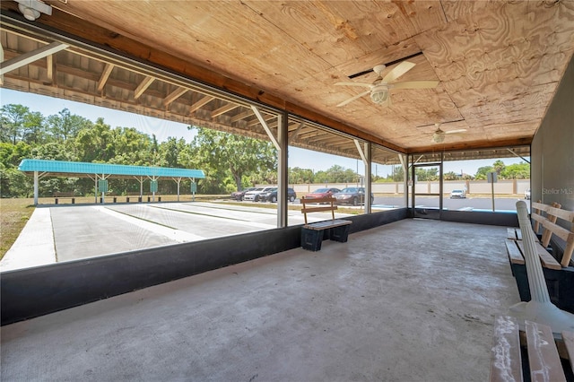 exterior space with ceiling fan