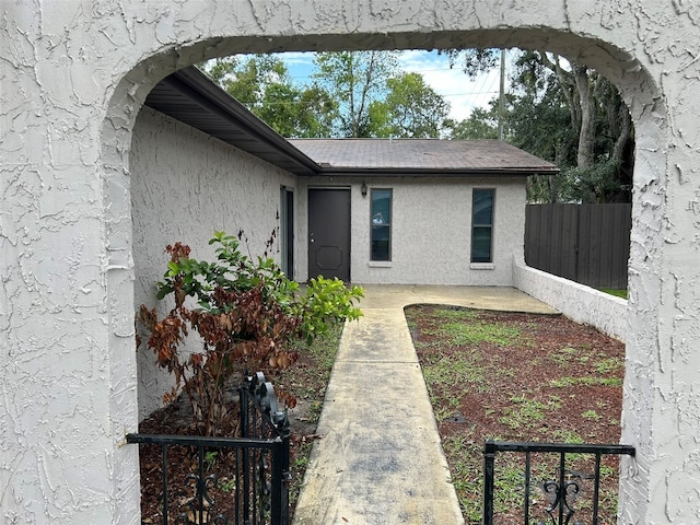 1309 Malone Ave, Spring Hill, FL 34606 - doorway to property with stucco siding and fence