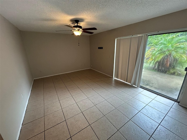 1309 Malone Ave, Spring Hill, FL 34606 - spare room featuring baseboards, a ceiling fan, a textured ceiling, and light tile patterned floors