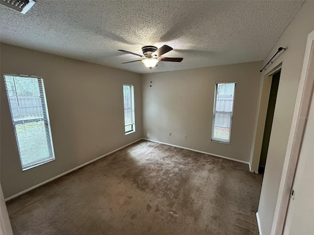 1309 Malone Ave, Spring Hill, FL 34606 - unfurnished bedroom featuring baseboards, visible vents, a textured ceiling, and carpet flooring