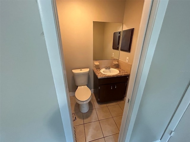 1309 Malone Ave, Spring Hill, FL 34606 - half bath featuring vanity, toilet, and tile patterned flooring