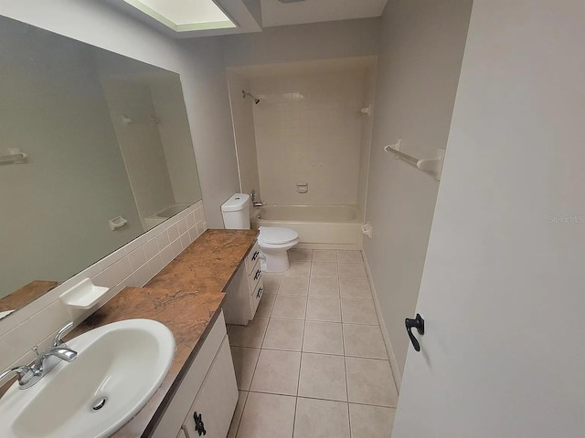 1309 Malone Ave, Spring Hill, FL 34606 - full bath with washtub / shower combination, tile patterned floors, vanity, and toilet