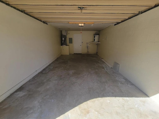1309 Malone Ave, Spring Hill, FL 34606 - garage with water heater, electric panel, and a garage door opener