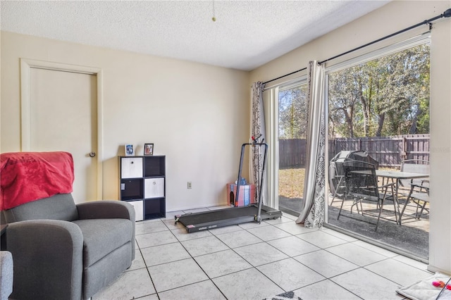 1309 Malone Ave, Spring Hill, FL 34606 - living area with a textured ceiling and light tile patterned floors