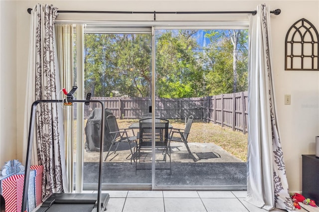 1309 Malone Ave, Spring Hill, FL 34606 - doorway to outside with tile patterned floors and a wealth of natural light