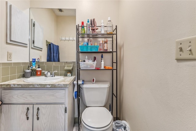 1309 Malone Ave, Spring Hill, FL 34606 - half bathroom featuring visible vents, toilet, and vanity