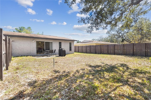 1309 Malone Ave, Spring Hill, FL 34606 - view of yard with a fenced backyard and a patio