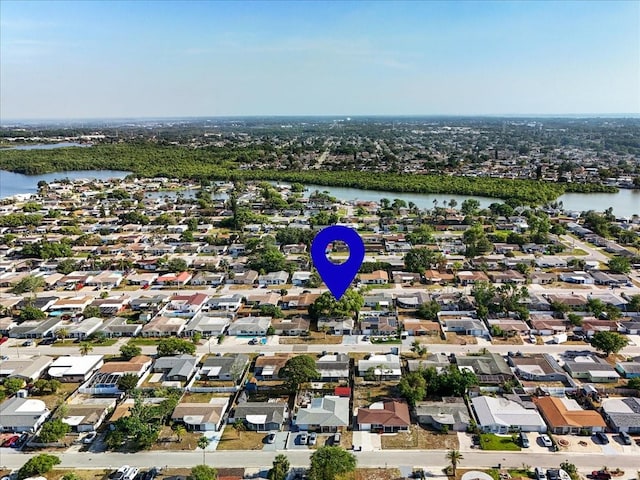 drone / aerial view with a residential view and a water view