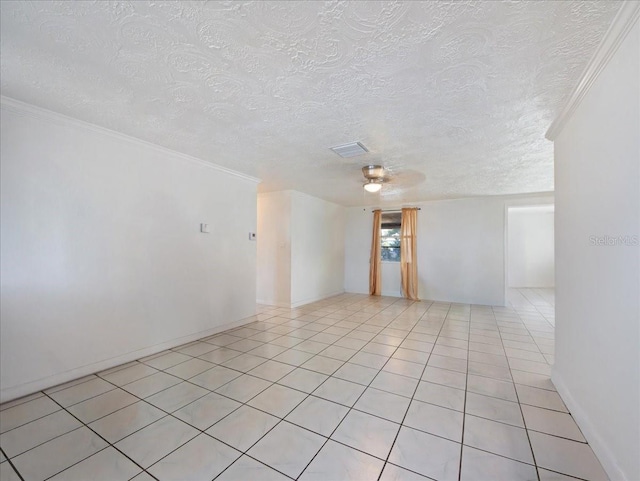 unfurnished room featuring light tile patterned floors and a textured ceiling
