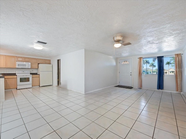 foyer entrance with light tile patterned flooring, a ceiling fan, visible vents, baseboards, and a textured ceiling