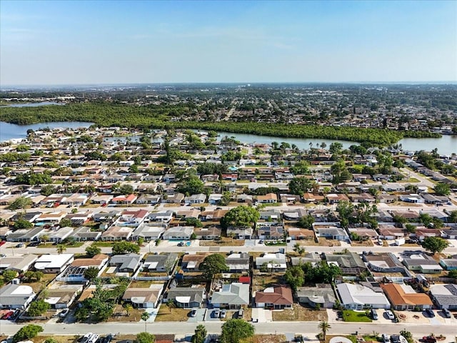 bird's eye view featuring a residential view and a water view