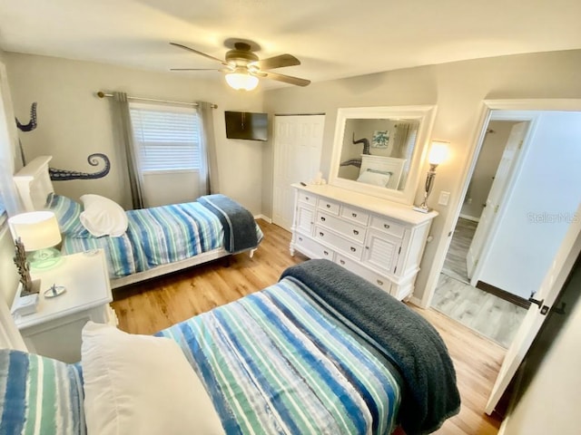 bedroom featuring ceiling fan, baseboards, a closet, and light wood-style flooring