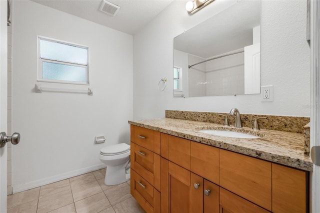 bathroom with toilet, visible vents, walk in shower, tile patterned flooring, and vanity