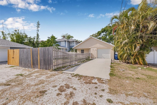 view of front of property with fence private yard and driveway