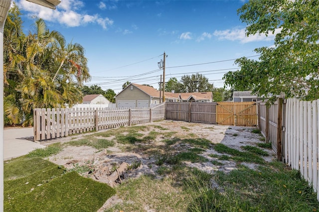 view of yard with a gate and fence private yard