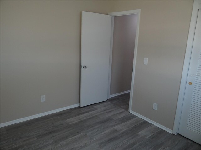 9825 41st St N, Pinellas Park, FL 33782 - interior space featuring baseboards and dark wood-style flooring