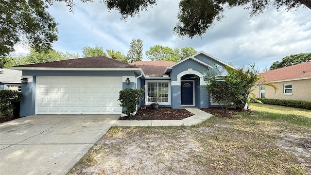 28818 Midnight Star Loop, Wesley Chapel, FL 33543 - ranch-style home featuring stucco siding, driveway, and an attached garage