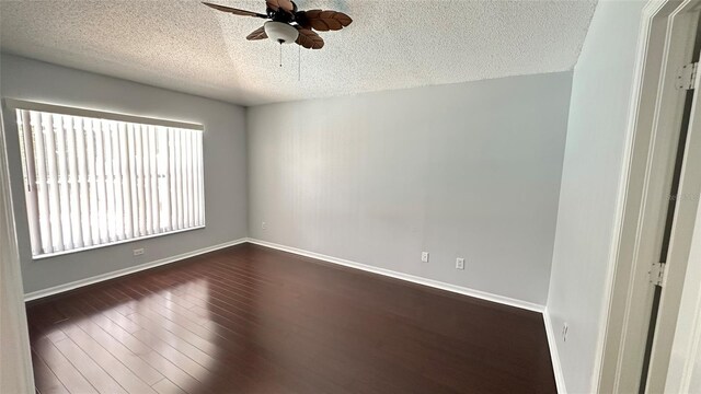 28818 Midnight Star Loop, Wesley Chapel, FL 33543 - unfurnished room featuring a textured ceiling, ceiling fan, dark wood-type flooring, and baseboards