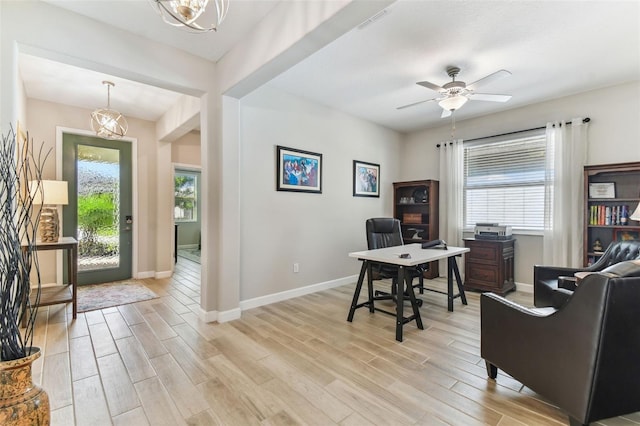 entryway with light wood-style flooring, a wealth of natural light, and baseboards