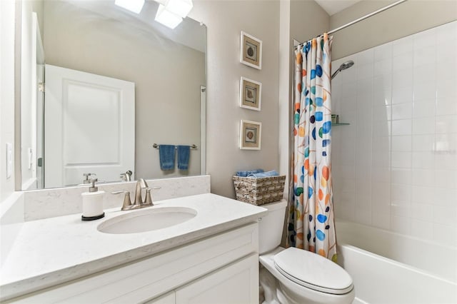 full bathroom with vanity, toilet, and shower / bath combo