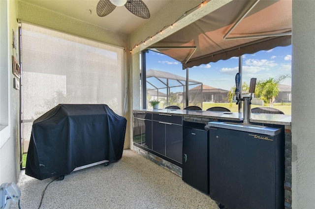 view of patio / terrace featuring grilling area and ceiling fan