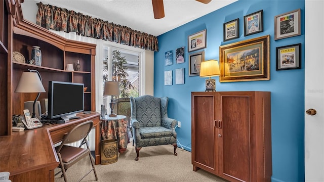 office area with carpet floors and ceiling fan