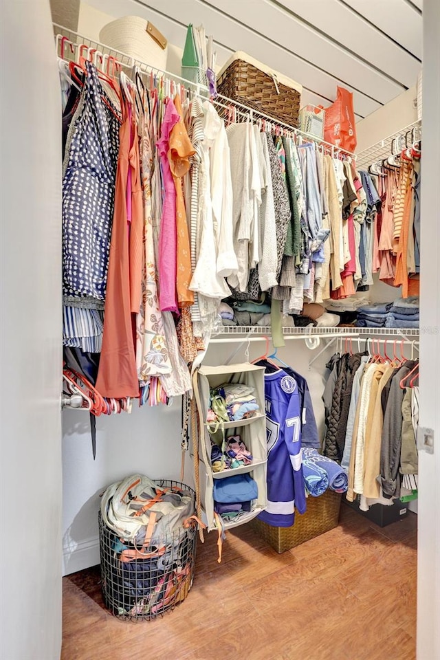 spacious closet featuring wood finished floors