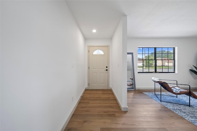 entrance foyer with recessed lighting, baseboards, and wood finished floors