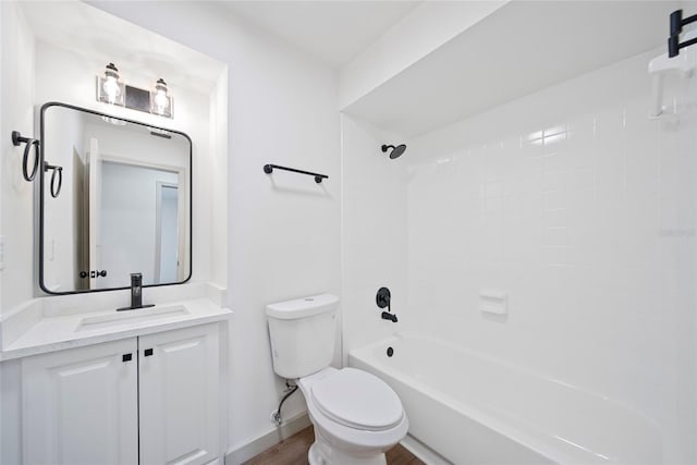 bathroom with toilet, shower / bath combination, vanity, baseboards, and wood finished floors