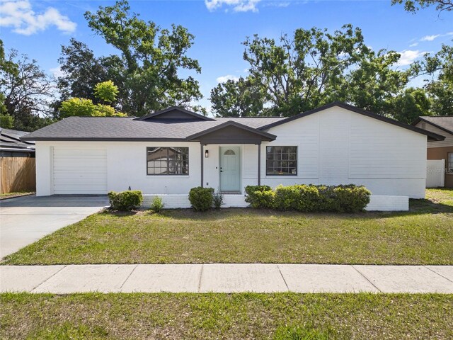 17815 Cranbrook Dr, Lutz, FL 33549 - ranch-style house with a garage and concrete driveway