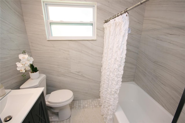 full bath featuring vanity, tile patterned floors, toilet, and shower / bath combination with curtain