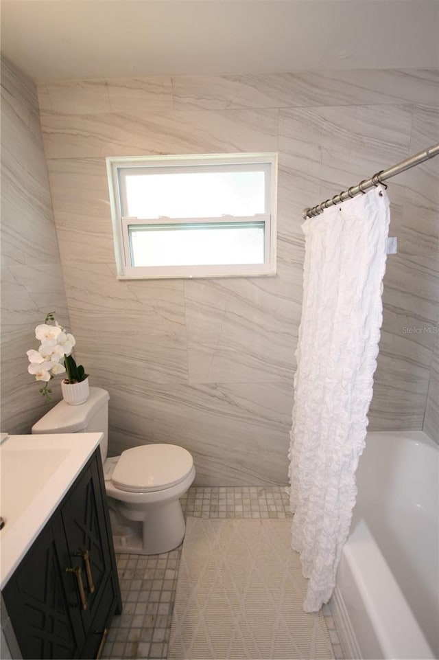 full bathroom with toilet, tile patterned floors, shower / bath combination with curtain, and vanity