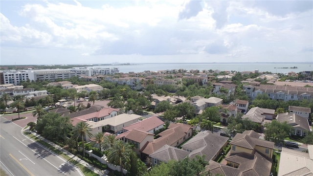 drone / aerial view with a residential view and a water view