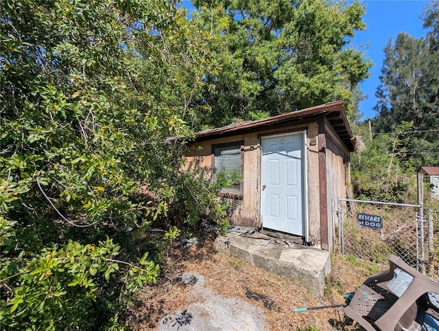 view of shed with fence
