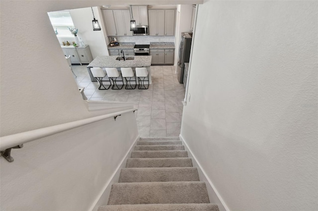 stairs with tile patterned flooring