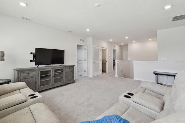 living room with recessed lighting and visible vents