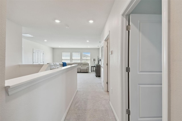 hallway with recessed lighting and carpet flooring