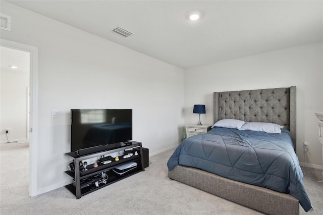bedroom featuring baseboards, carpet flooring, and visible vents