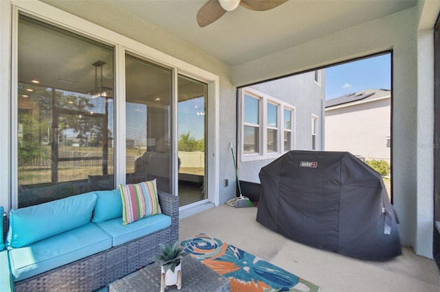 sunroom / solarium featuring an outdoor living space and a ceiling fan