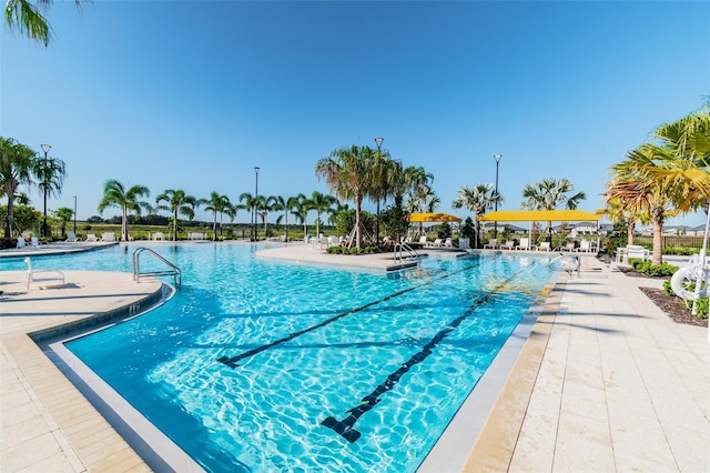 community pool with a patio area