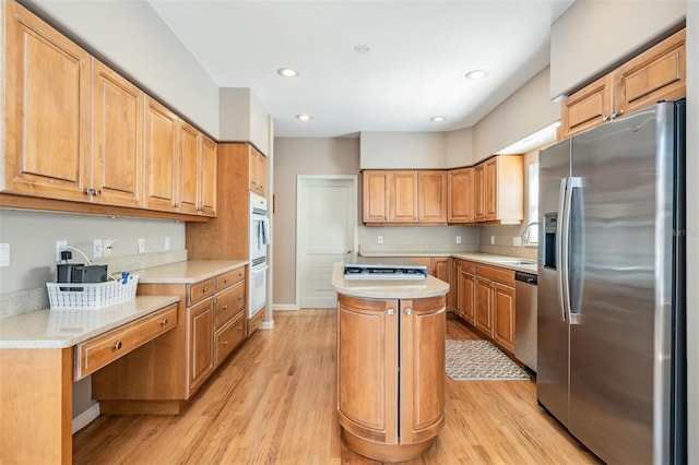 2704 Chambray Ln, Tampa, FL 33611 - kitchen with appliances with stainless steel finishes, light wood-style floors, light countertops, and recessed lighting
